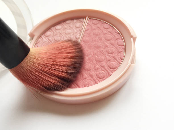 A highlighter brush is picking up eyeshadow