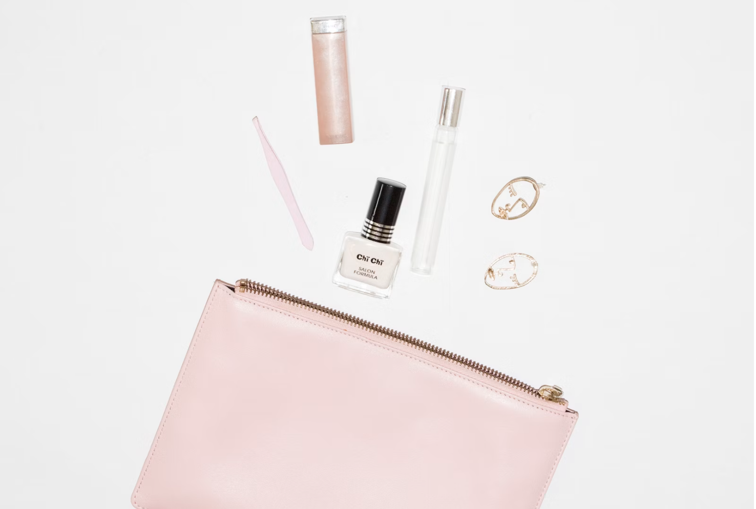 a pink cosmetic bag and some makeups